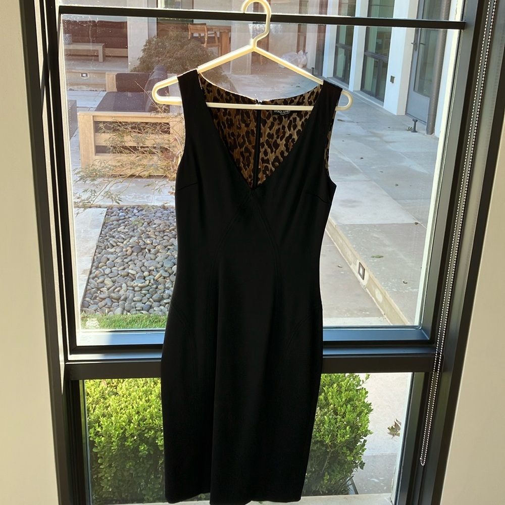 Dolce gabbana (40) size 4-6. Black. Beautiful dress fits like a glove